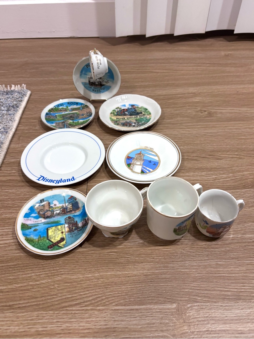 Assorted White Ceramic Souvenir Mugs & Plates with Colorful Park Scenes